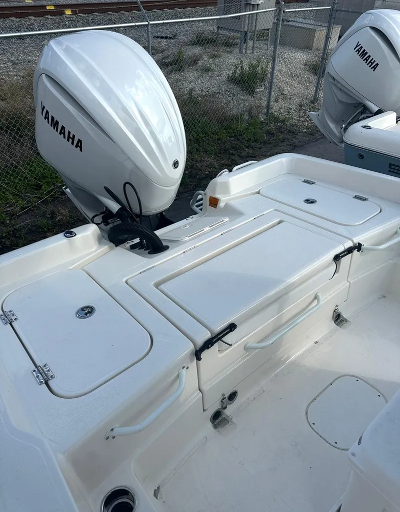 Slide: The Image of 2025 Skeeter SX 2350 boat with Yamaha outboard motor, white deck, and storage compartments. - 9