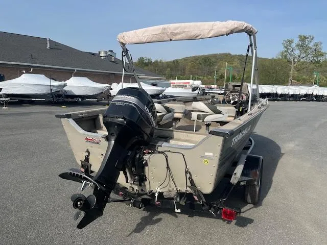 Slide: The Image of 2001 Tracker Pro Deep V 17 SC boat with outboard motor in a parking lot. - 6