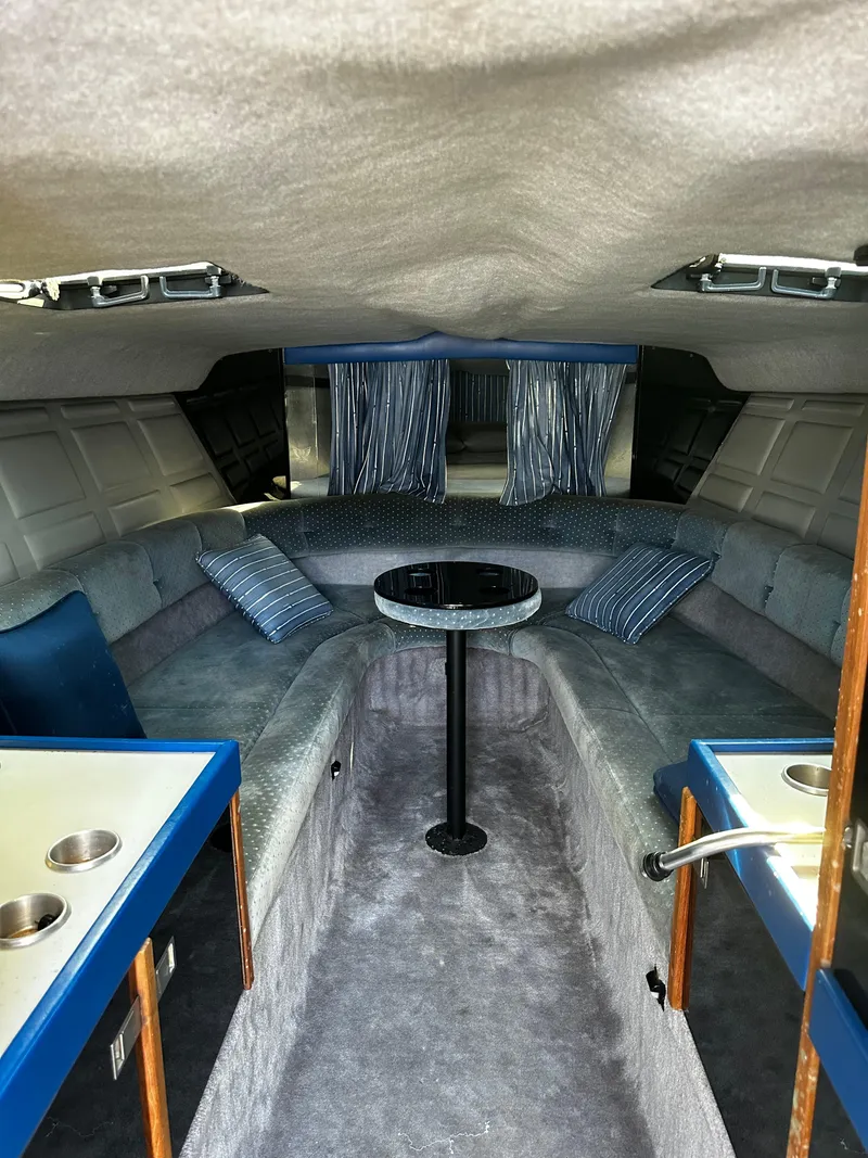 Slide: The Image of Interior of a 1987 Formula 357 SR1 boat with seating and table. - 7