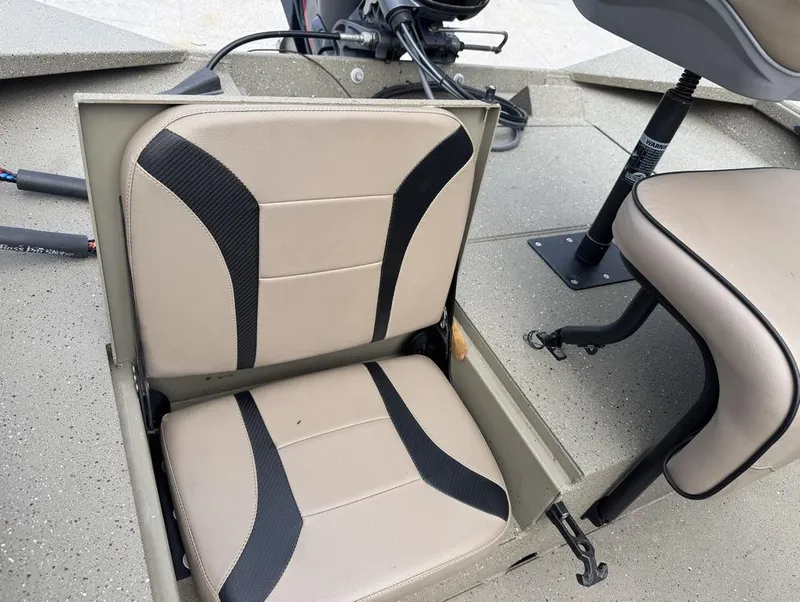 Slide: The Image of 2019 Alumacraft 18 Bay boat seats with beige and black design. - 16