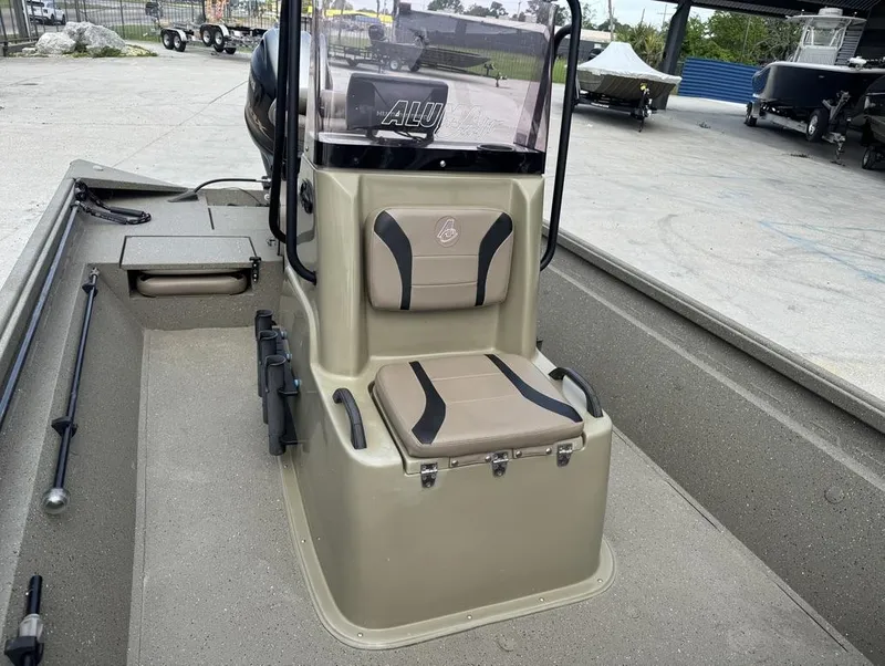 Slide: The Image of 2019 Alumacraft 18 Bay boat interior with seating and console. - 4