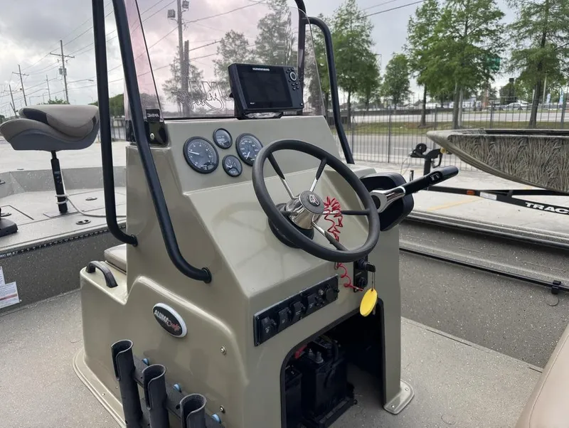Slide: The Image of 2019 Alumacraft 18 Bay boat console with steering wheel and gauges. - 6