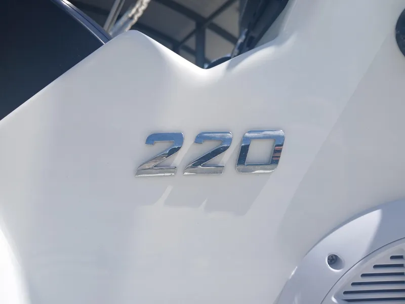 Slide: The Image of Close-up of Excel 220 model emblem on a white surface, 2022. - 11