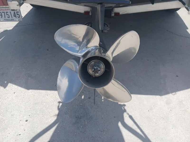 Slide: The Image of Four-blade boat propeller on Excel 220, 2022 model, mounted on a trailer. - 14