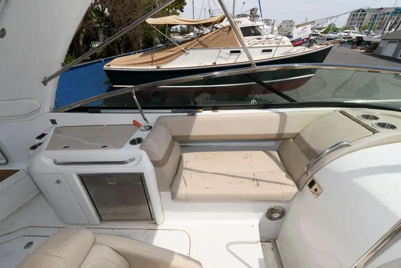 Slide: The Image of 2012 Formula 290 Sun Sport boat interior with seating and kitchenette. - 10