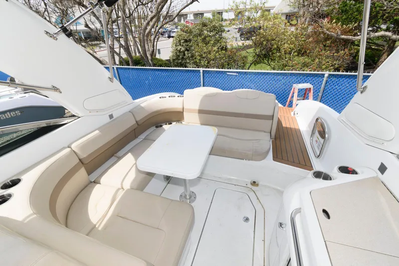 Slide: The Image of 2012 Formula 290 Sun Sport boat with spacious seating and table on deck. - 11