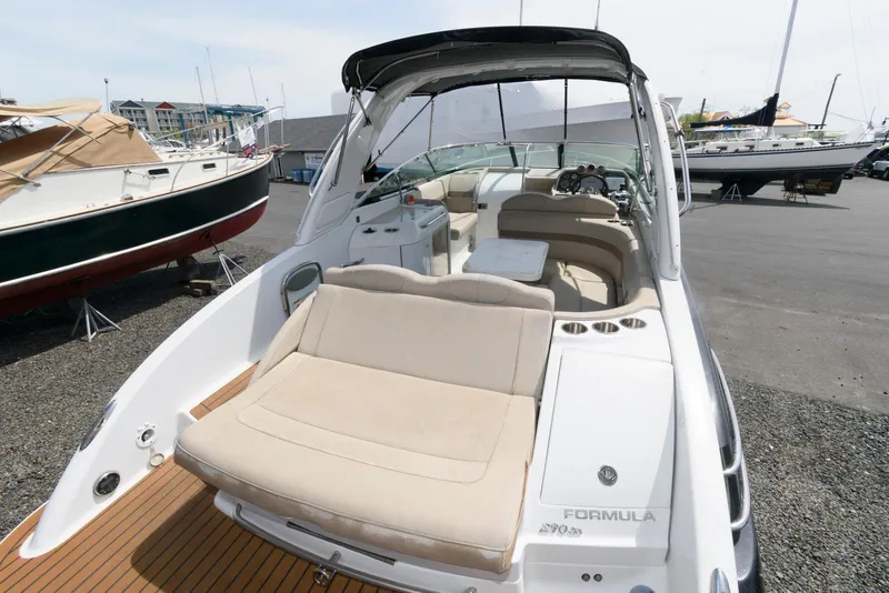 Slide: The Image of 2012 Formula 290 Sun Sport boat with spacious seating and sleek design. - 12