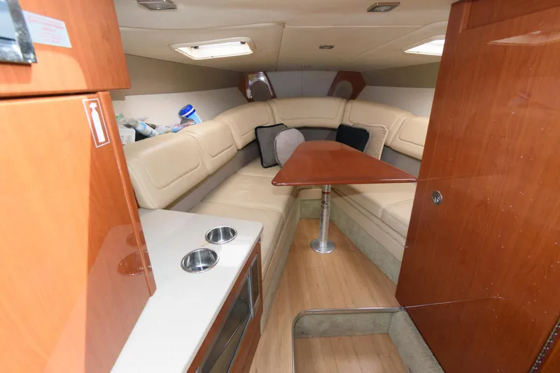 Slide: The Image of Interior of 2012 Formula 290 Sun Sport boat with seating and table. - 13