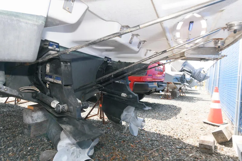 Slide: The Image of 2012 Formula 290 Sun Sport boat in dry dock, showing dual propellers and outboard motors. - 17