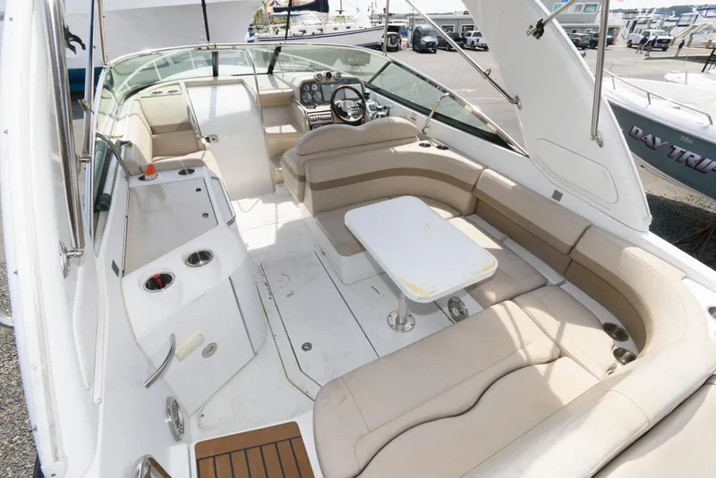 Slide: The Image of 2012 Formula 290 Sun Sport boat interior with seating and table, showcasing luxury design. - 5