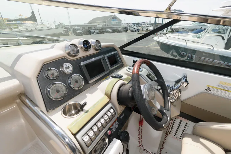 Slide: The Image of 2012 Formula 290 Sun Sport dashboard with steering wheel and control gauges. - 9