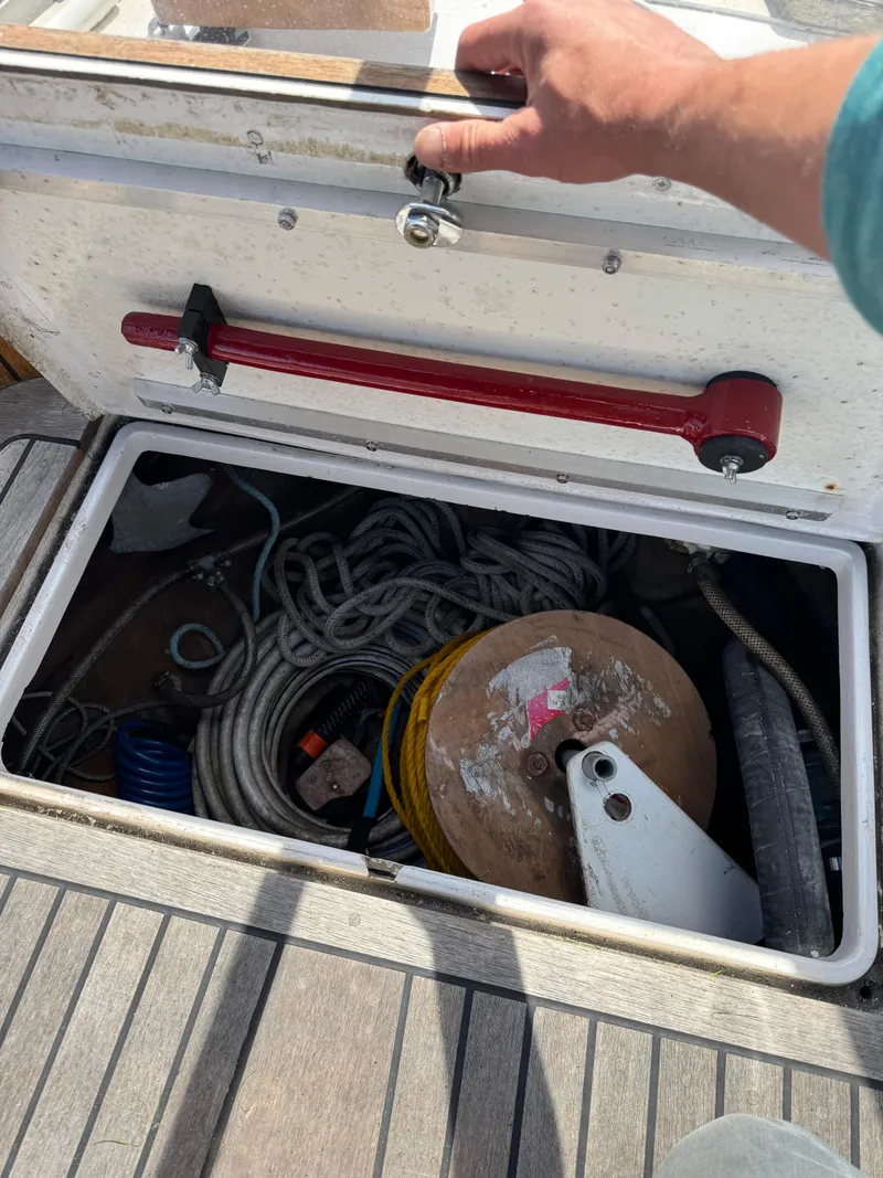 Slide: The Image of Storage compartment on 1984 Ohlson 38 sailboat with ropes and equipment. - 18