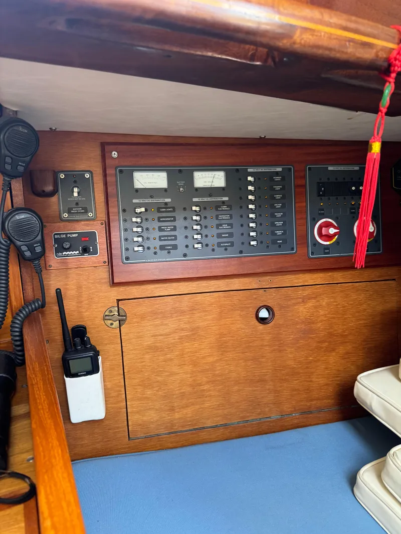 Slide: The Image of Control panel of a 1984 Ohlson 38 sailboat with communication equipment and switches. - 21