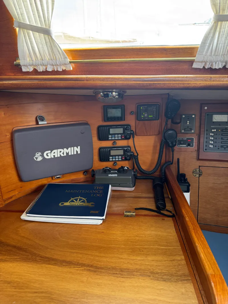 Slide: The Image of Navigation station on 1984 Ohlson 38 sailboat with Garmin equipment and logbook. - 22