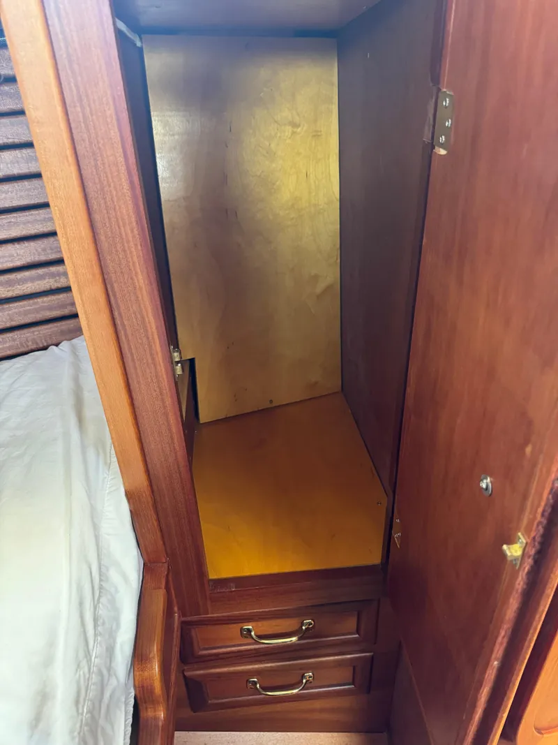 Slide: The Image of Wooden closet interior with drawers in a 1984 Ohlson 38 sailboat. - 37