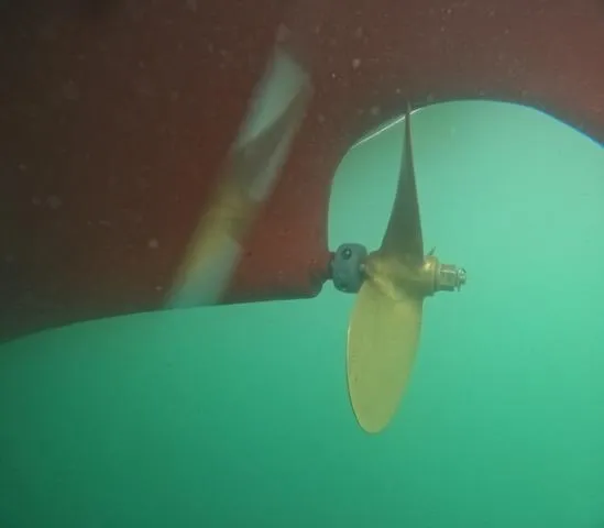 Slide: The Image of Underwater view of a 1984 Ohlson 38 boat propeller in motion. - 7