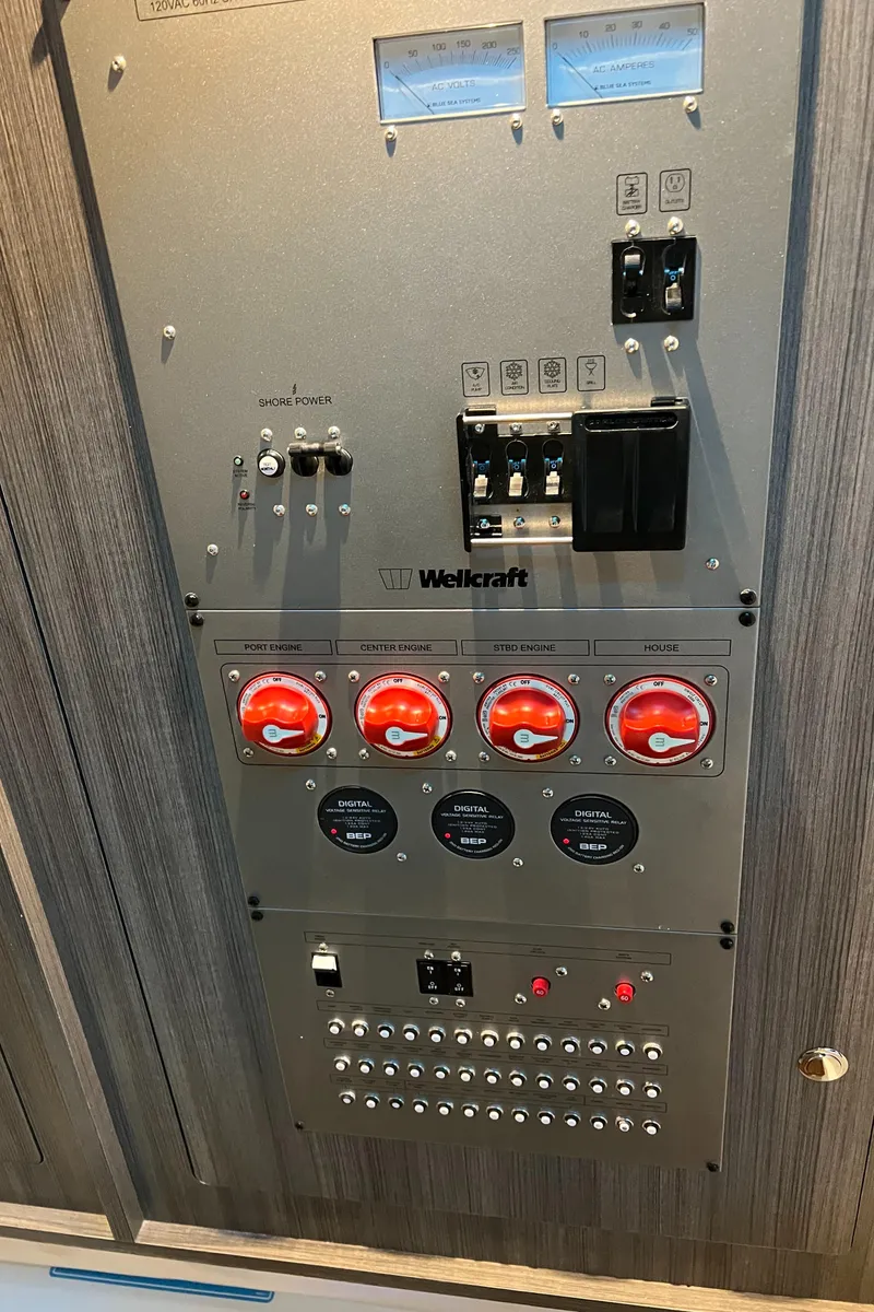 Slide: The Image of Control panel of 2024 Wellcraft 352 Fisherman boat with switches and gauges. - 24