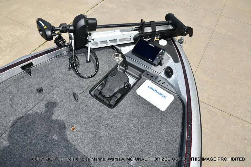 Slide: The Image of 2024 Triton 18 TRX boat deck with Lowrance electronics and Minn Kota trolling motor. - 10