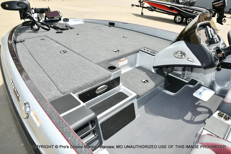 Slide: The Image of 2024 Triton 18 TRX boat interior with advanced controls and spacious deck. - 12