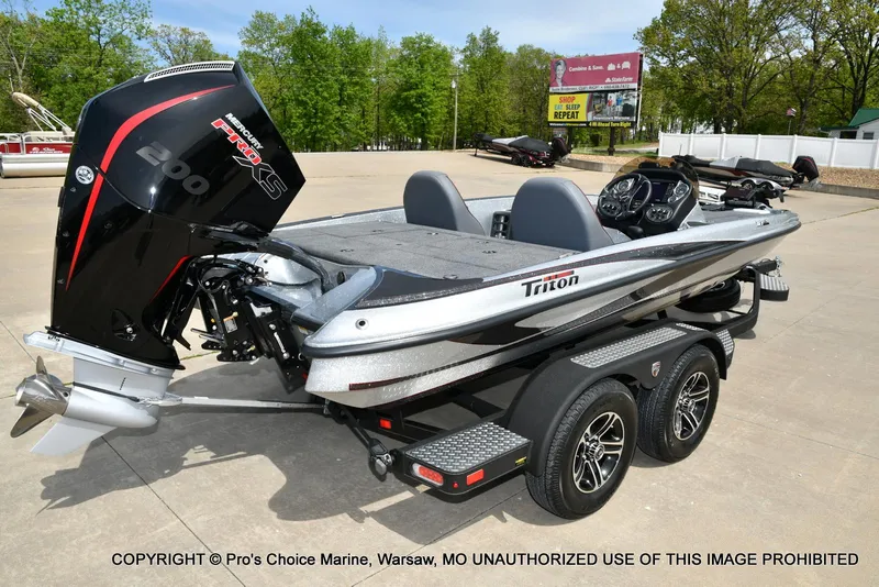 Slide: The Image of 2024 Triton 18 TRX boat with 200 Pro-XS engine on a trailer. - 15