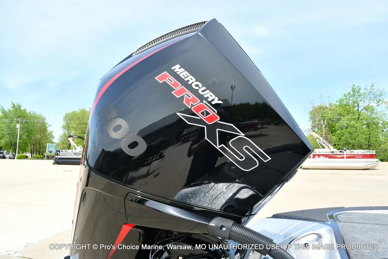 Slide: The Image of 2024 Triton 18 TRX with Mercury 200 Pro-XS engine, outdoor setting. - 18