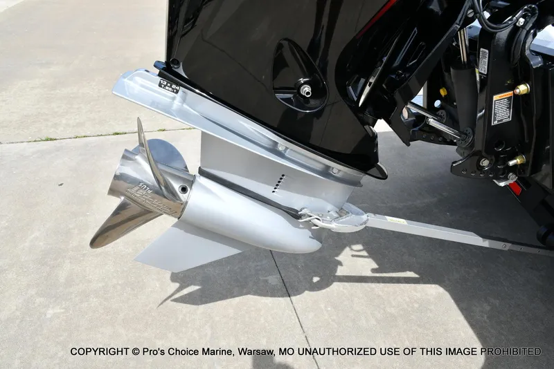 Slide: The Image of 2024 Triton 18 TRX w/200 Pro-XS boat motor and propeller on concrete surface. - 20