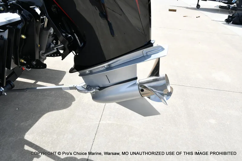 Slide: The Image of 2024 Triton 18 TRX w/200 Pro-XS outboard motor close-up on concrete surface. - 21