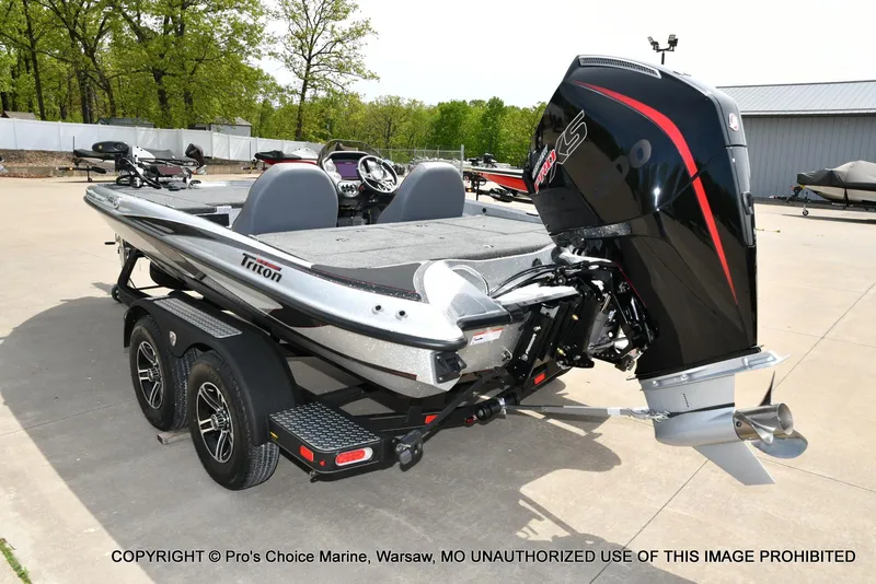 Slide: The Image of 2024 Triton 18 TRX boat with 200 Pro-XS engine on a trailer. - 24