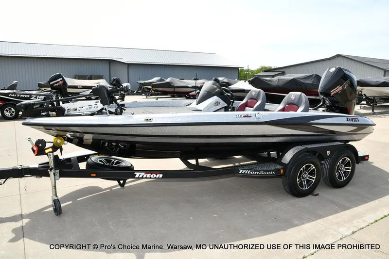 Slide: The Image of 2024 Triton 18 TRX boat with 200 Pro-XS engine on trailer. - 26