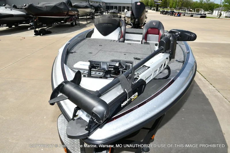 Slide: The Image of 2024 Triton 18 TRX boat with 200 Pro-XS engine, parked outdoors. - 29
