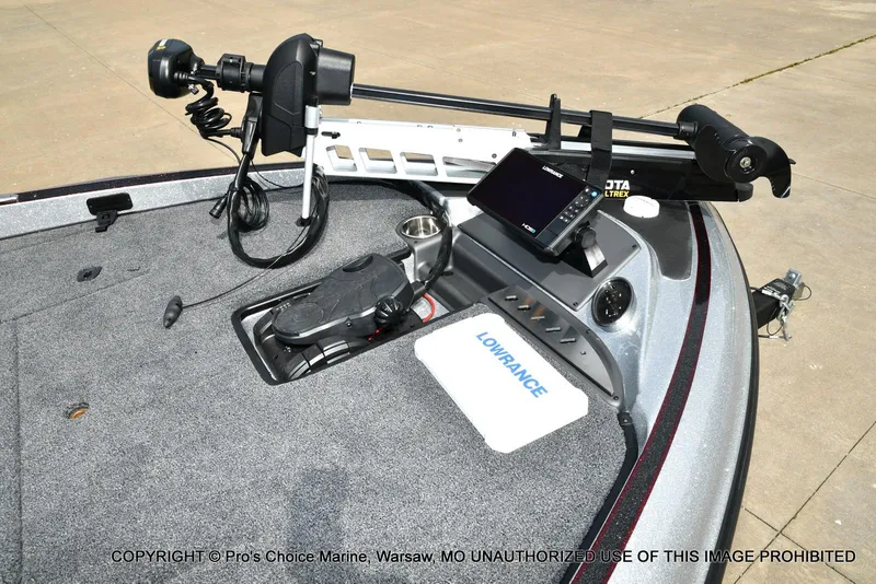 Slide: The Image of 2024 Triton 18 TRX boat deck with Lowrance electronics and Minn Kota trolling motor. - 3