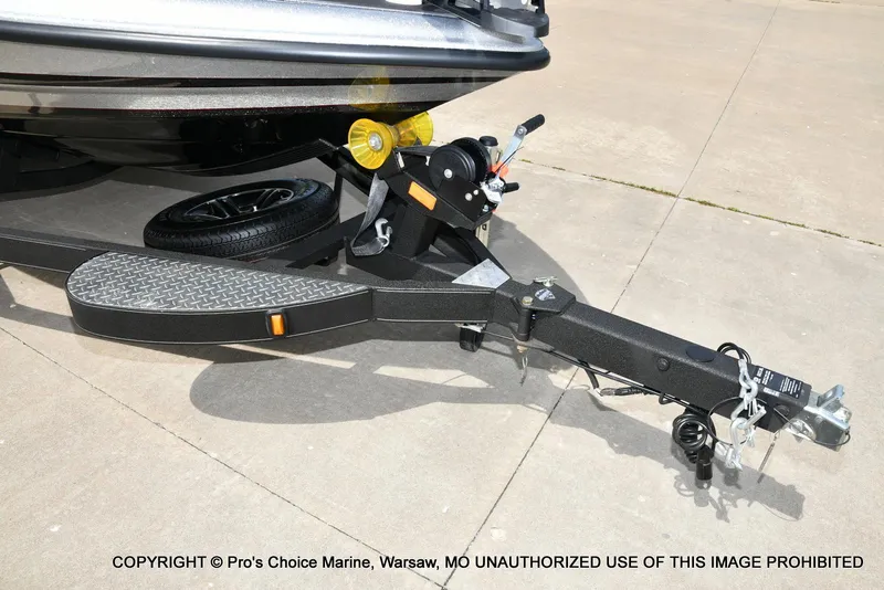 Slide: The Image of Trailer hitch of 2024 Triton 18 TRX w/200 Pro-XS boat on concrete surface. - 31