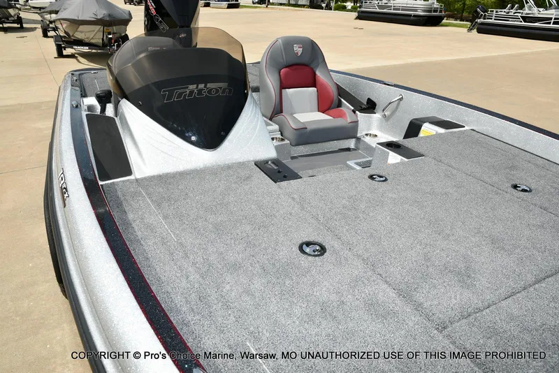 Slide: The Image of 2024 Triton 18 TRX boat with 200 Pro-XS engine, featuring spacious deck and seating. - 33