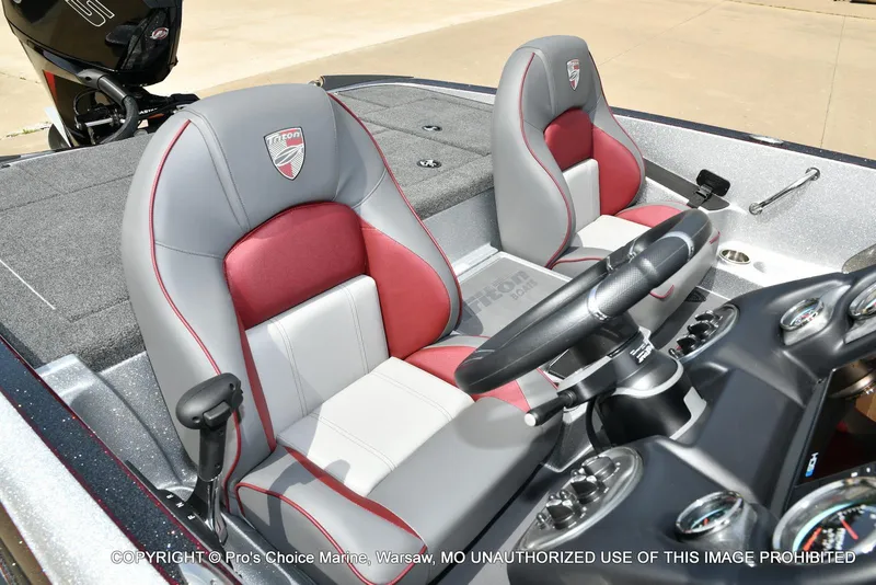 Slide: The Image of 2024 Triton 18 TRX boat interior with dual seats and steering console. - 34