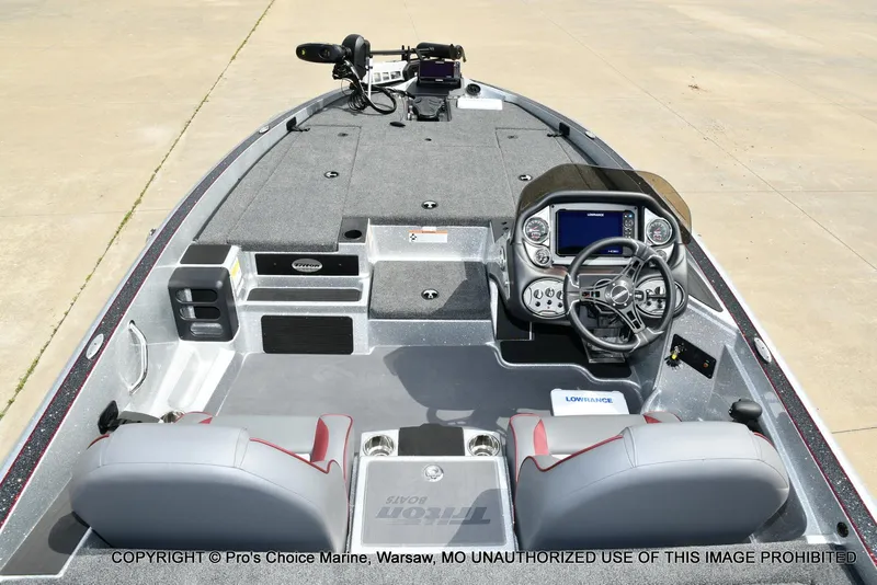 Slide: The Image of 2024 Triton 18 TRX boat interior with advanced dashboard and seating. - 38