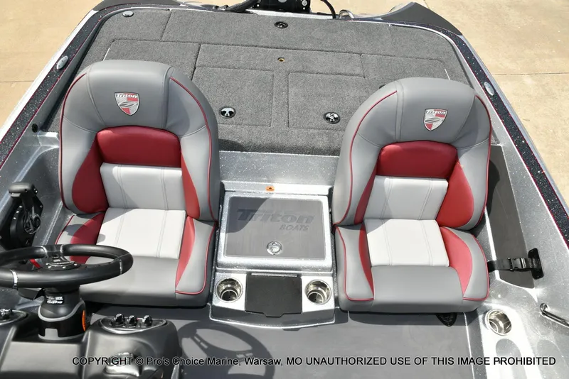 Slide: The Image of 2024 Triton 18 TRX boat interior with dual gray and red seats. - 48