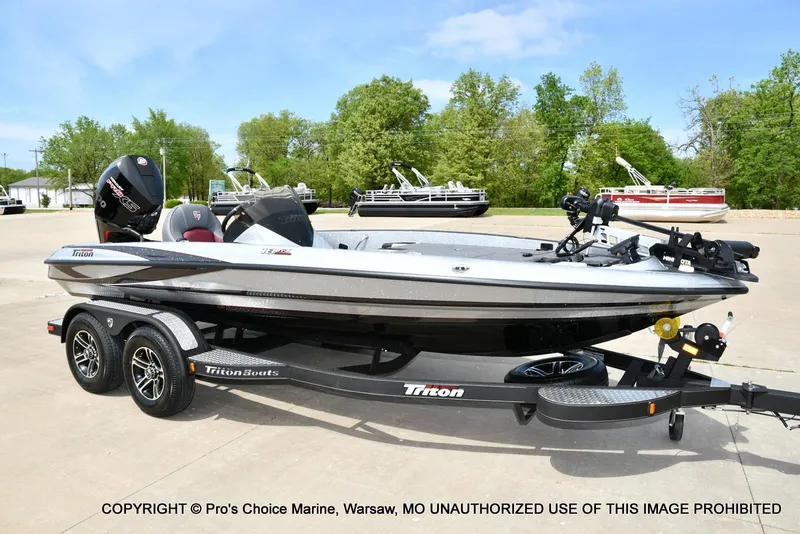 Slide: The Image of 2024 Triton 18 TRX w/200 Pro-XS boat on trailer, parked outdoors. - 68
