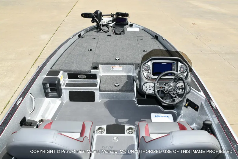 Slide: The Image of 2024 Triton 18 TRX boat interior with advanced dashboard and seating. - 8