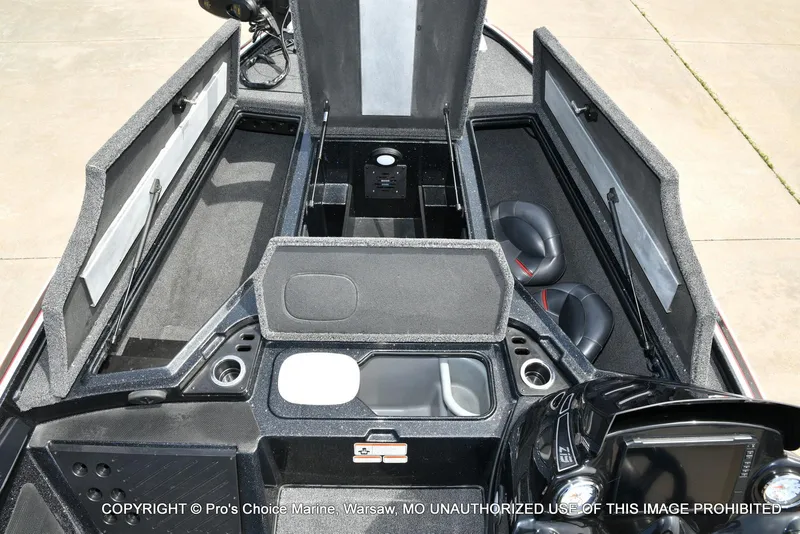 Slide: The Image of 2018 Nitro Z19 Pro Pack boat interior with open storage compartments and seating. - 10
