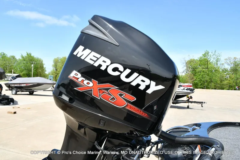 Slide: The Image of Mercury Pro XS outboard motor on 2018 Nitro Z19 Pro Pack boat, parked outdoors. - 20