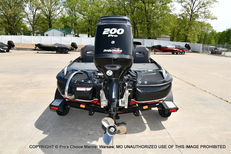 Slide: The Image of 2018 Nitro Z19 Pro Pack boat with 200 Pro engine in a parking lot. - 26