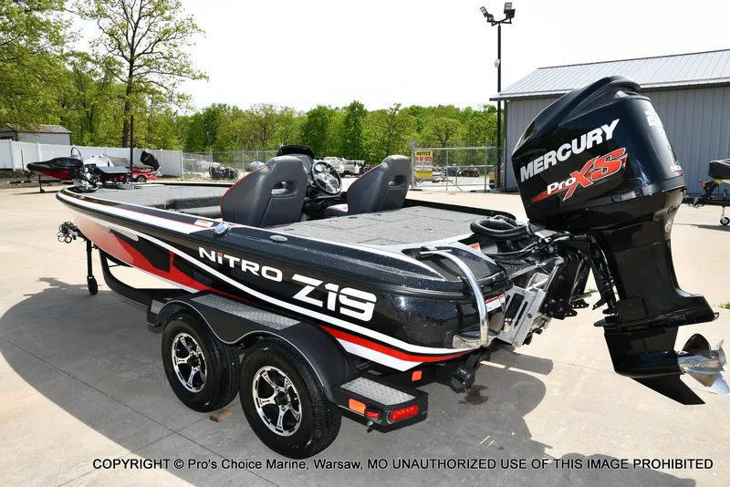 Slide: The Image of 2018 Nitro Z19 Pro Pack boat with Mercury Pro XS engine, parked outdoors. - 27