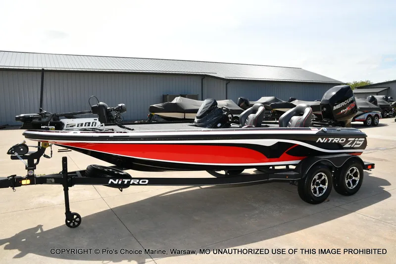 Slide: The Image of 2018 Nitro Z19 Pro Pack boat with trailer, parked outdoors. - 29