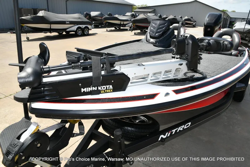 Slide: The Image of 2018 Nitro Z19 Pro Pack boat with Minn Kota Ultrex motor on trailer. - 32
