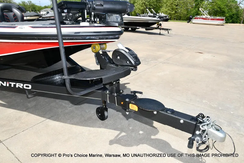 Slide: The Image of 2018 Nitro Z19 Pro Pack boat trailer hitch in a parking lot. - 35