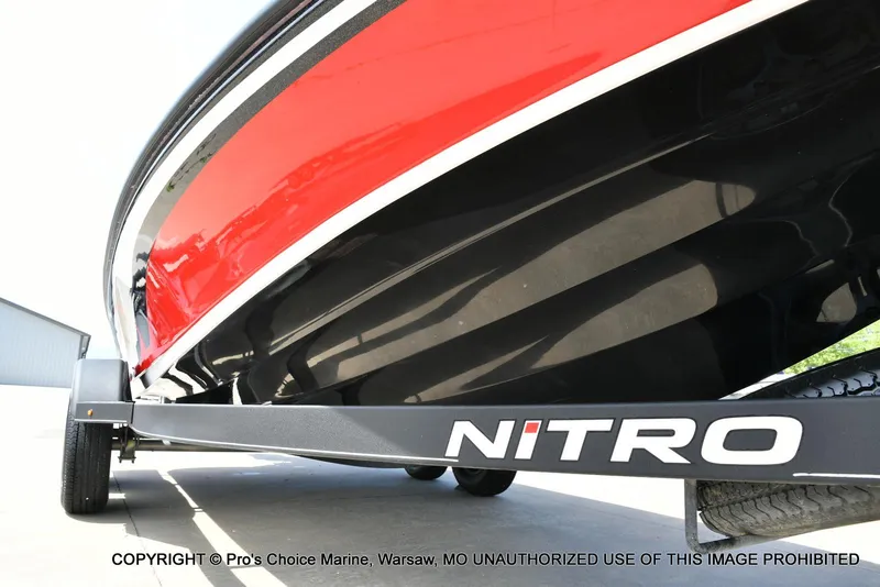 Slide: The Image of 2018 Nitro Z19 Pro Pack boat on trailer, red and black design. - 36