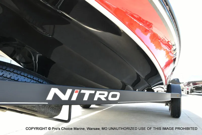 Slide: The Image of 2018 Nitro Z19 Pro Pack boat on trailer, close-up view of hull and logo. - 37