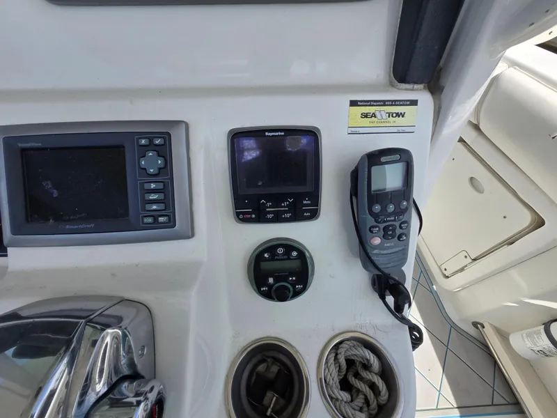 Slide: The Image of Control panel of a 2013 Boston Whaler 280 Outrage boat with navigation equipment. - 18