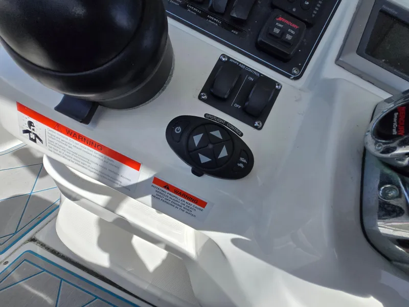 Slide: The Image of Control panel of a 2013 Boston Whaler 280 Outrage boat with warning labels. - 19