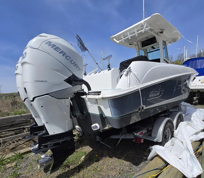 Slide: The Image of 2013 Boston Whaler 280 Outrage boat with Mercury Verado engine on trailer. - 2